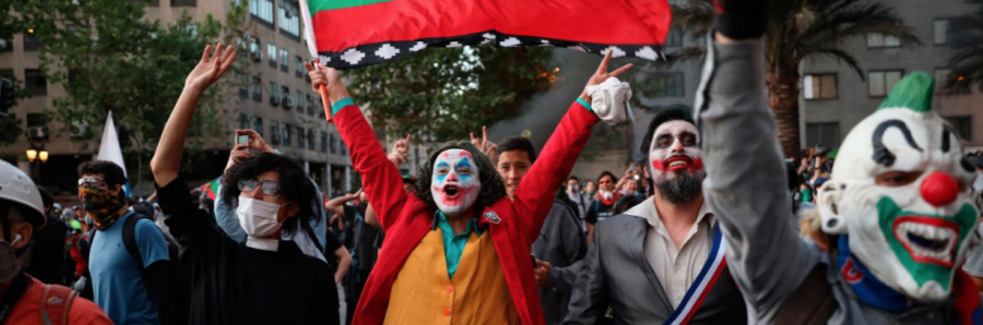 Protestors wearing Joker make up and wearing clown masks that were in the film
