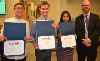 (left to right: Muhammad Chowdhry, Elliot Parrish, Lanie Mae Rasay, & James Edwards at Board Meeting.)
“Niles North Principal James Edwards recognized three students who are creating awareness throughout the school about environmental issues.” District 219 announcement said.
