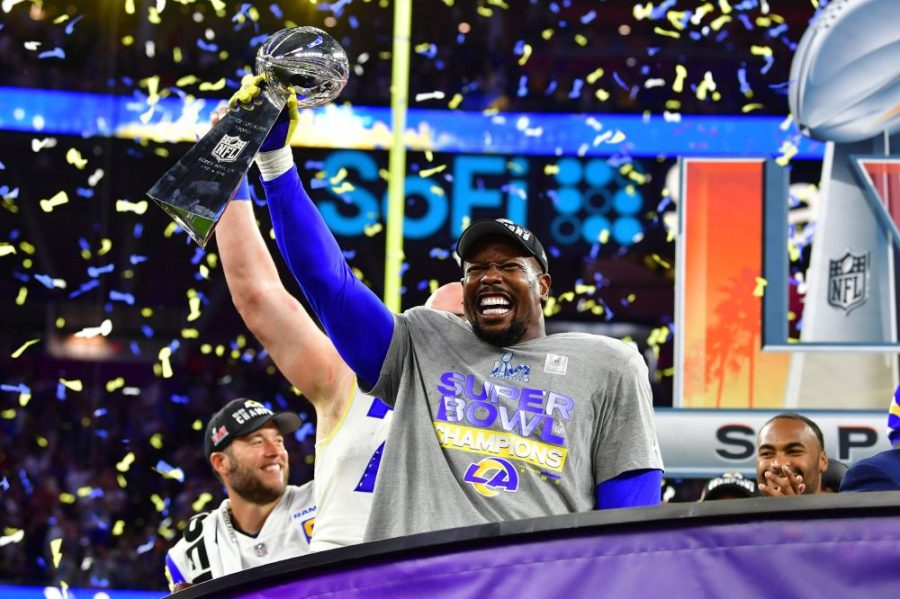 Rams edge rusher Von Miller hoisting the Lombardi trophy after the Rams 23-20 win over the Bengals