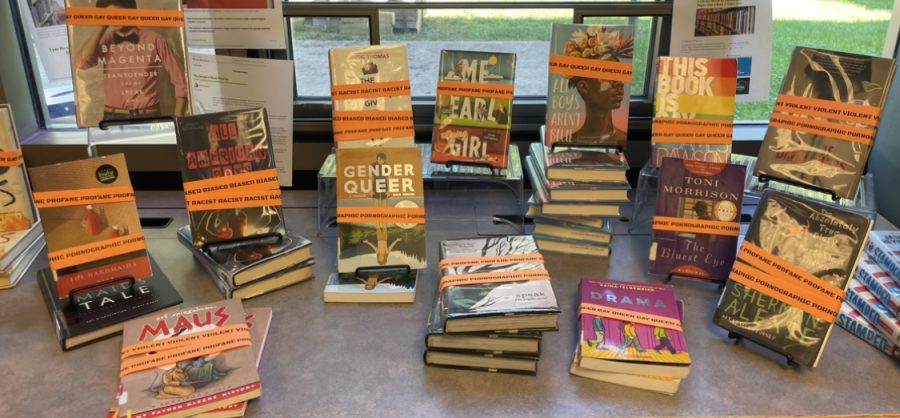 “A display of books that have been challenged/banned in schools by Caitlin Greener