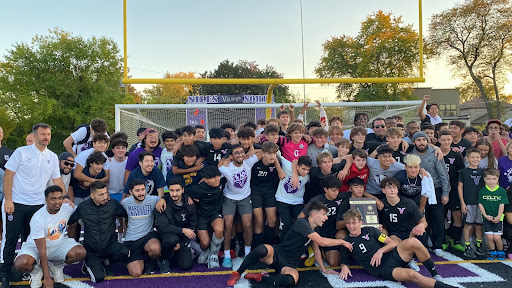 The Varsity Soccer players and coaches celebrate with fans after defeating Taft H.S. (2-1) to capture the Regional Championship.
