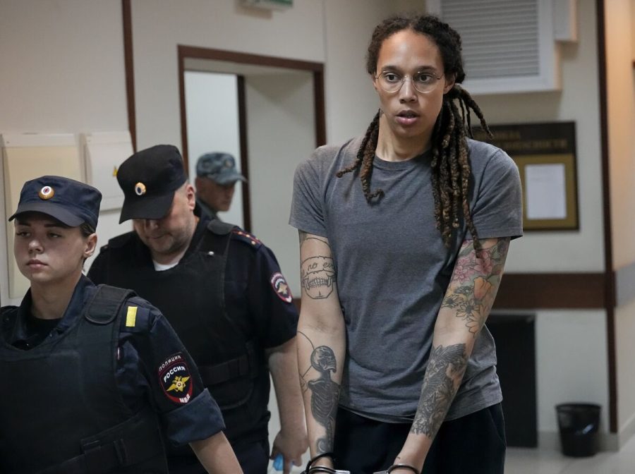 Britney Griner walks in handcuffs under the Russian penal system.