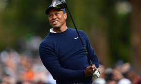 Tiger stares down a drive off the tee. 
