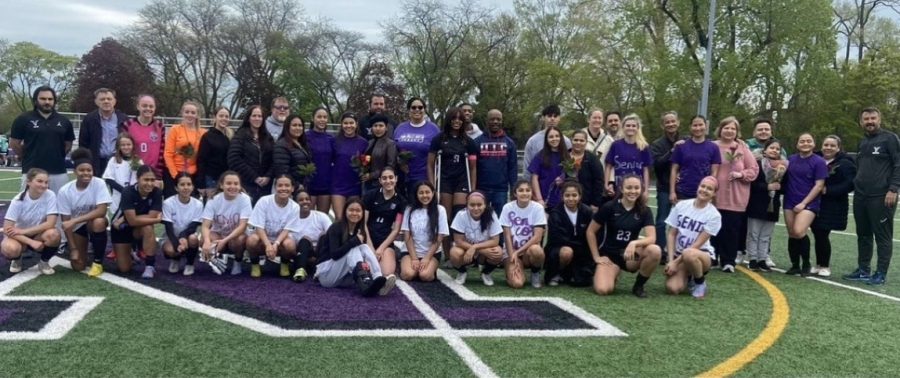 Girls' soccer team celebrates win with family and coaches