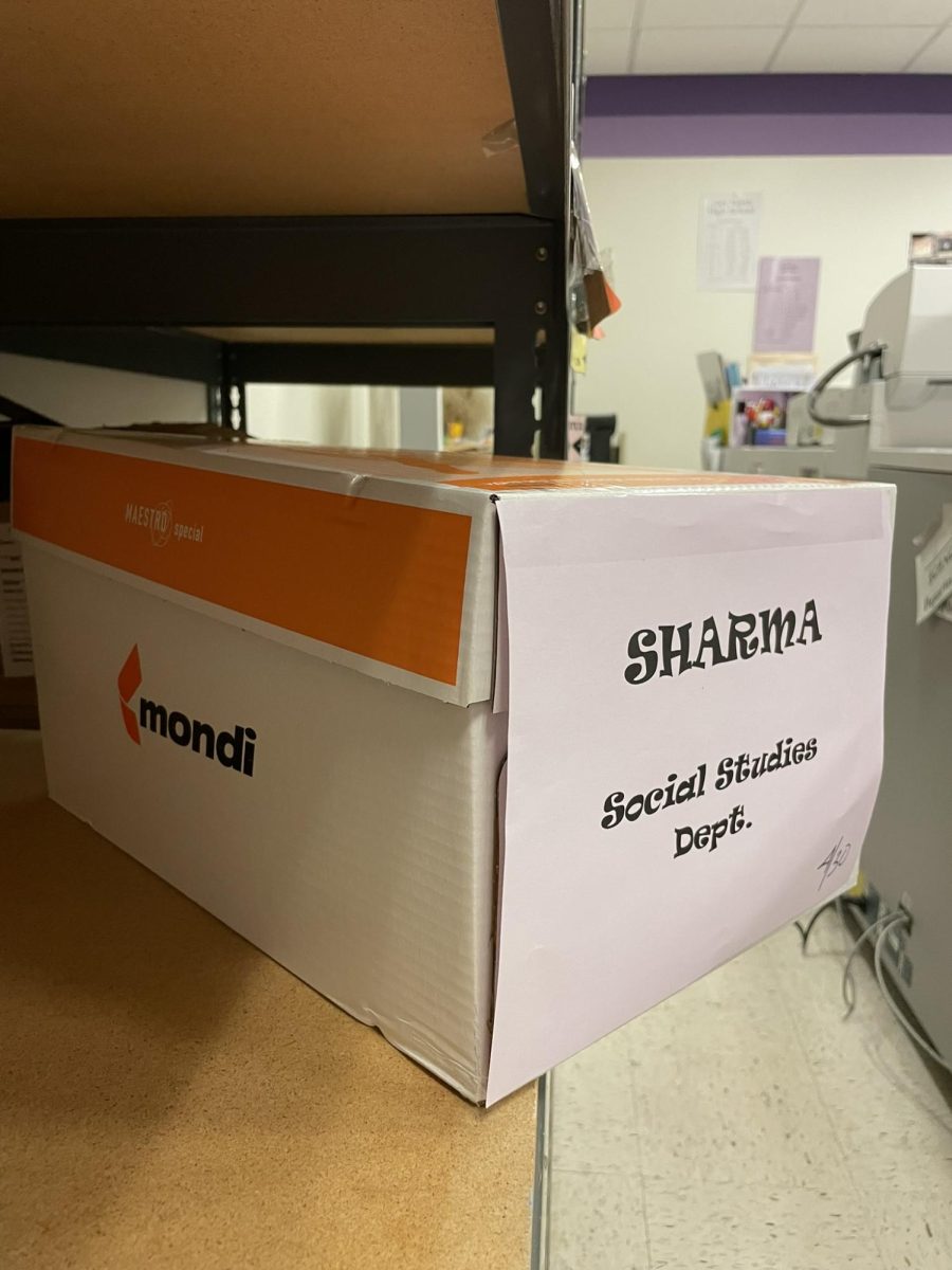 A box full of study packets wait peacefully in the duplicating room for Mr. Sharma.