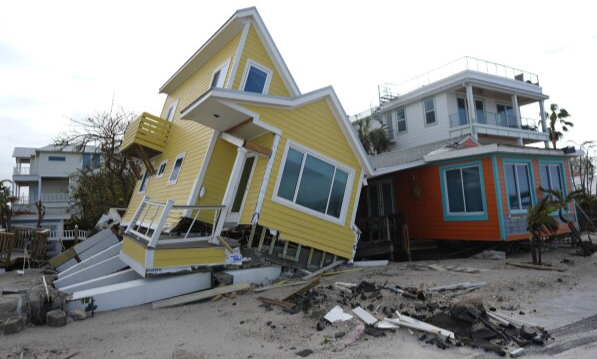 Hurricane Milton damaged beach houses in Bradenton Beach. Image courtesy of The Guardian. 
