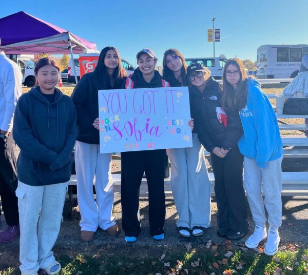 Senior Sobia Shethwala, flanked by supporters, at State. 