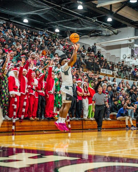 Senior Andy Simon pulling up for three during the Crosstown Classic on Dec. 6.