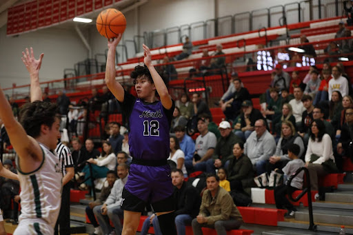 Senior Dylan Lam pulling up for three in the Hinsdale Central Holiday Classic.
