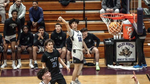 Dylan Lam sinks a three point shot during Niles North's game against Taft, Feb. 26; Leo Bearman/leobearsnaps