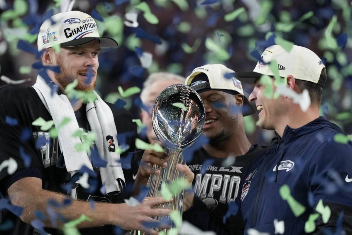 Seahawks quarterback Sam Darnold (left), Super Bowl MVP Kenneth Walker III (center) and head coach Mike Macdonald celebrate with the Lombardi Trophy after defeating the New England Patriots 29-13 at Super Bowl LX at Levi’s Stadium in Santa Clara, California on Sunday, Feb. 8, 2026. (Photo courtesy of the Seattle Seahawks)


