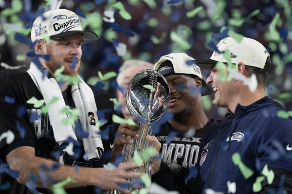 Seahawks quarterback Sam Darnold (left), Super Bowl MVP Kenneth Walker III (center) and head coach Mike Macdonald celebrate with the Lombardi Trophy after defeating the New England Patriots 29-13 at Super Bowl LX at Levi’s Stadium in Santa Clara, California on Sunday, Feb. 8, 2026. (Photo courtesy of the Seattle Seahawks)

